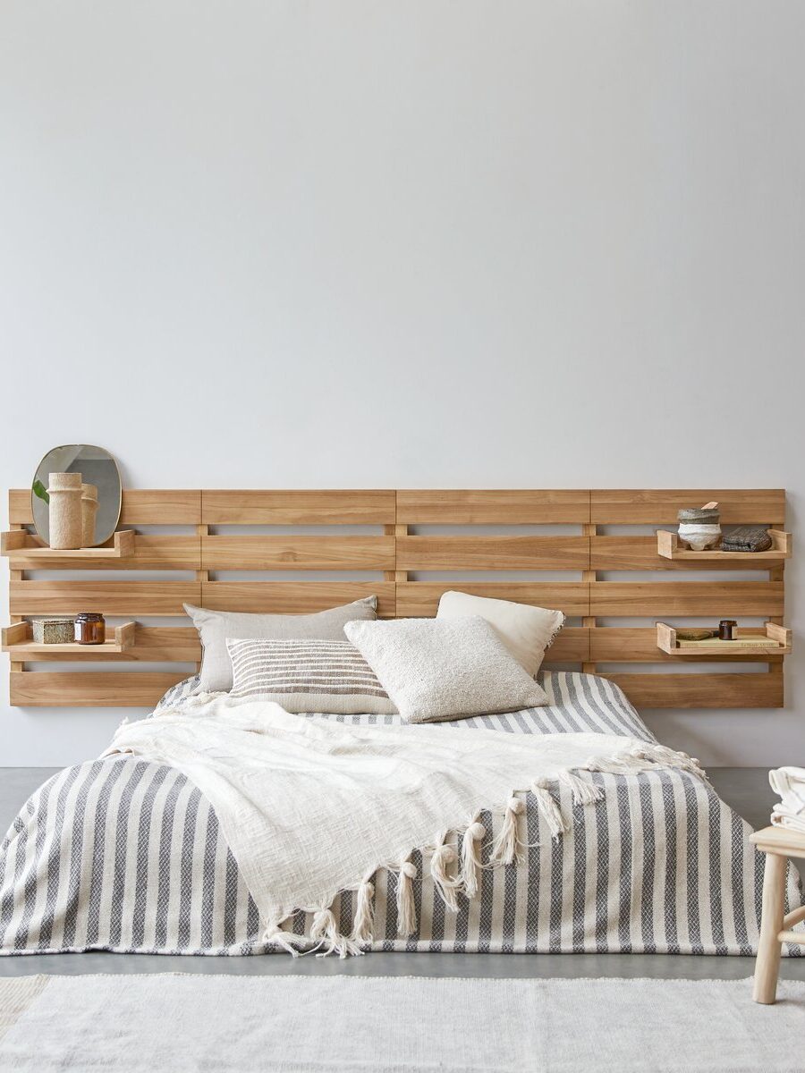 A unique wooden headboard for a bed
