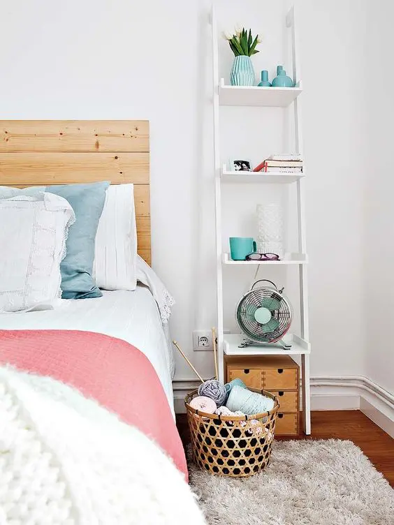 A white bedside table from a tall ladder